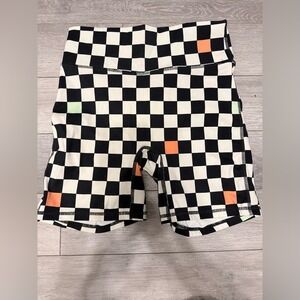 Fabletics Black and White Checkered Shorts with Orange Accents